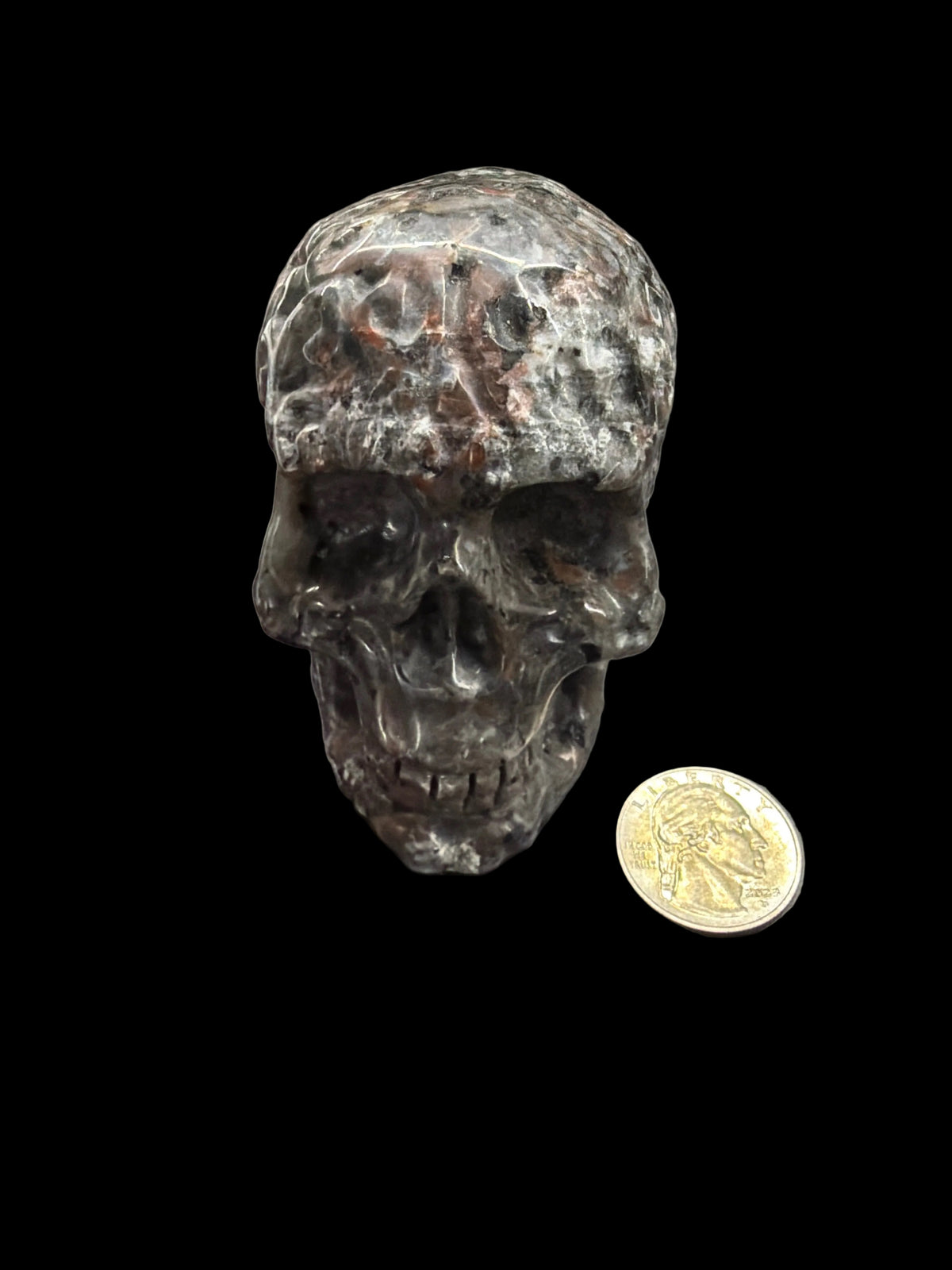 Carved crystal skull med.