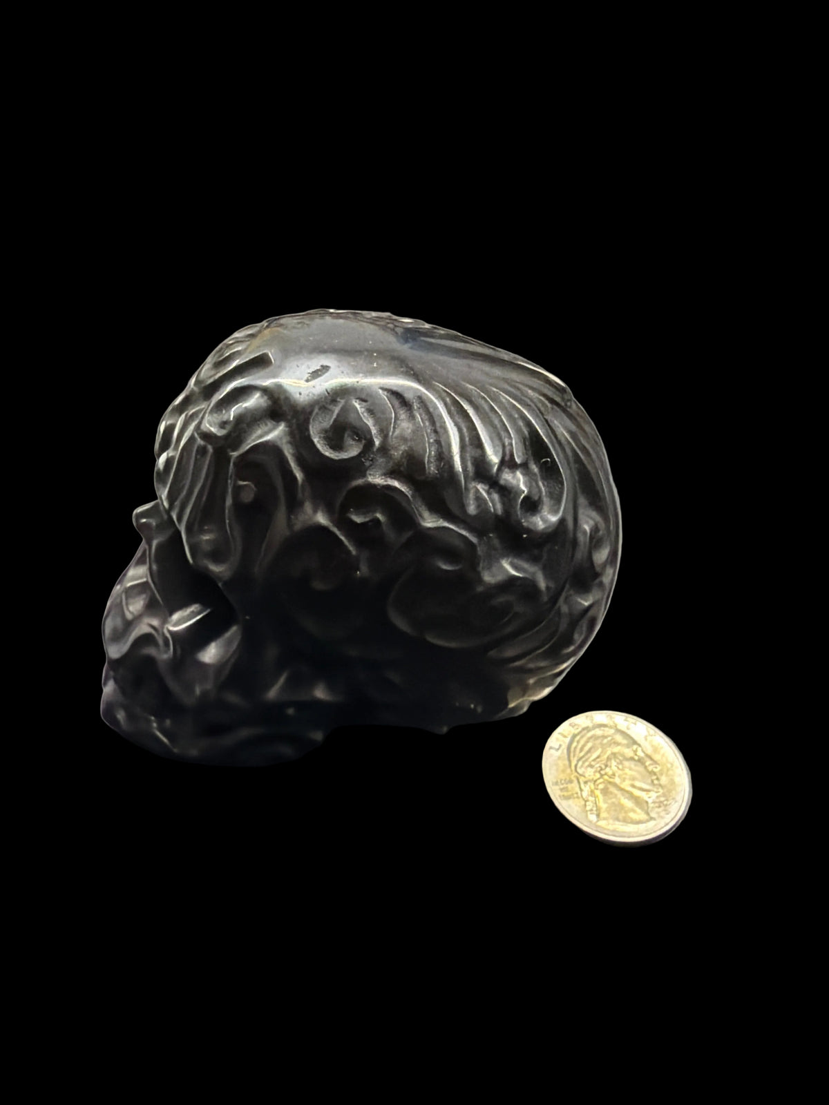 Carved crystal skull med.