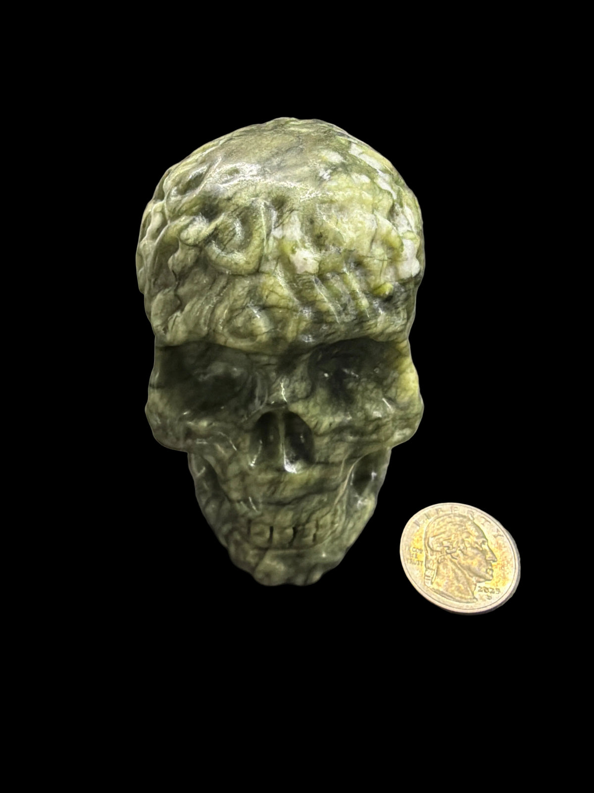 Carved crystal skull med.