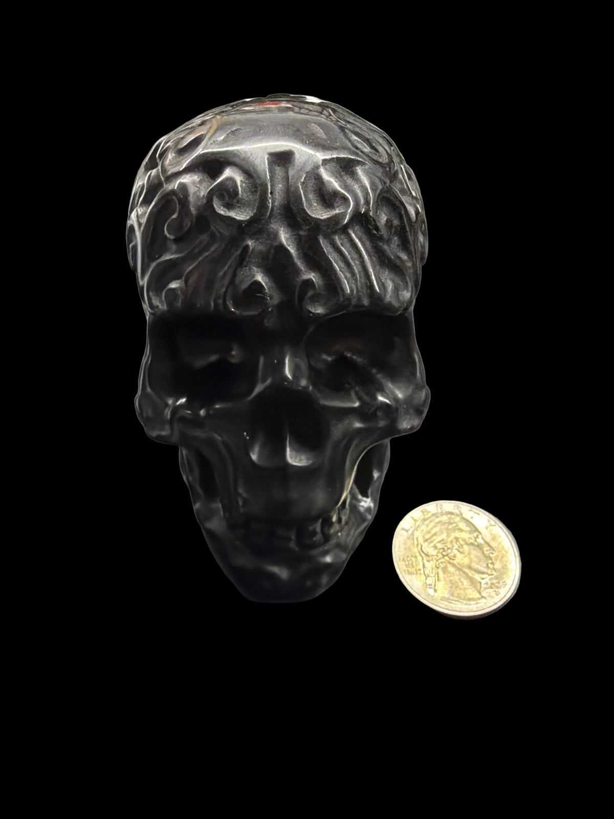 Carved crystal skull med.