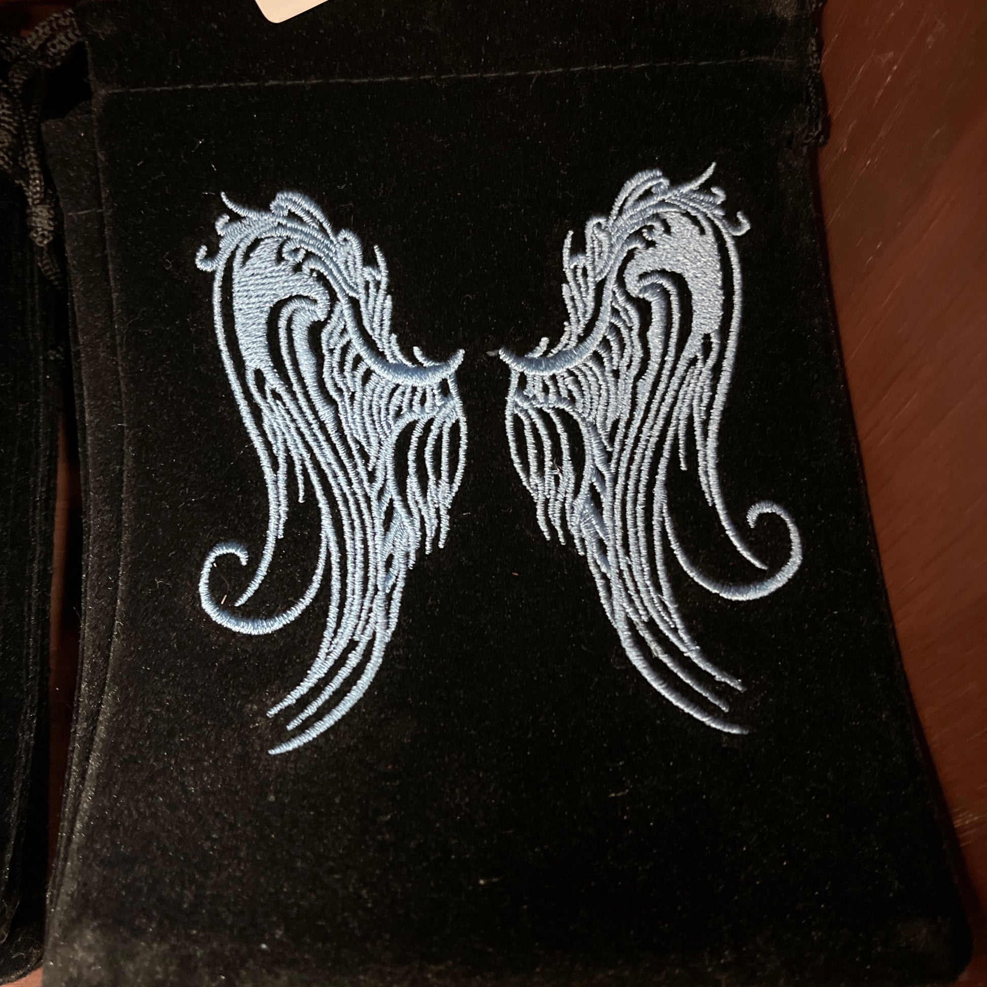 Angel wings embroidered velvet bag