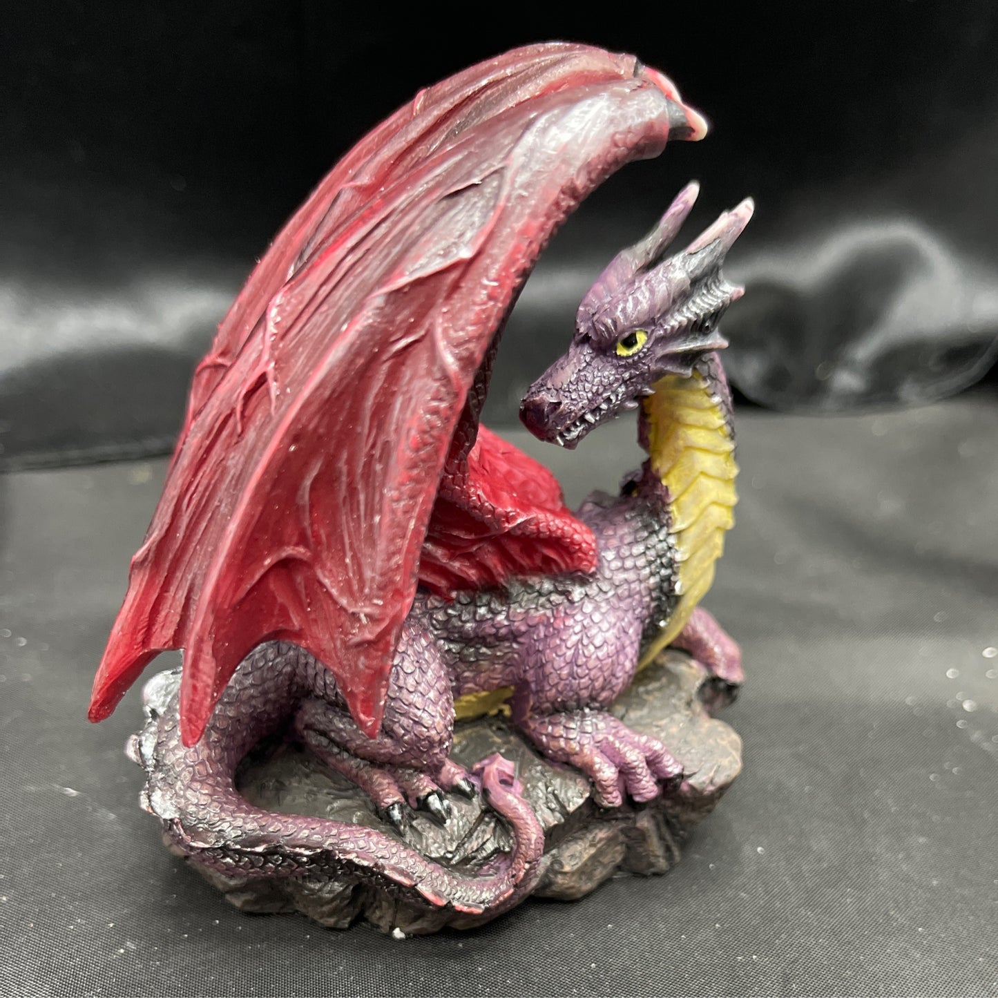 Purple Dragon on Rock